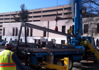 Steel being erected with a boom truck