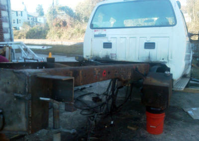 BEFORE: Rusted ford truck plow truck frame...